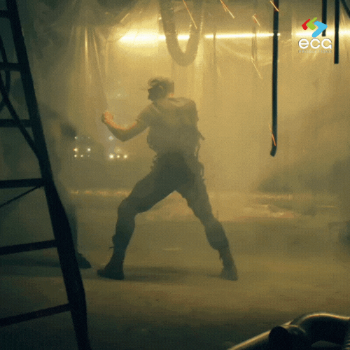 A cinematic frame from an ECG narrative film, capturing a protagonist mid-action in a beautifully composed shot.