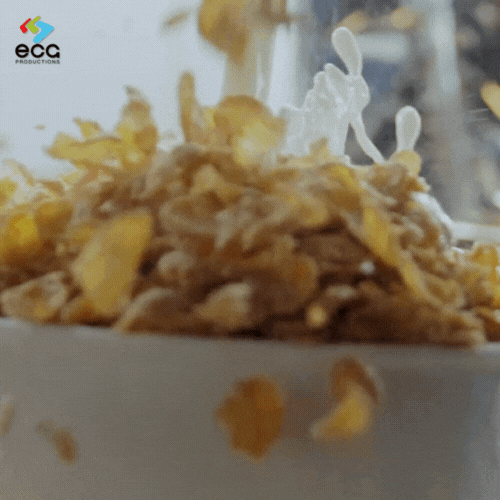A bowl of cereal is drenched in an excessive amount of milk, creating a playful and exaggerated moment that commercial scriptwriting brings to life in advertising.