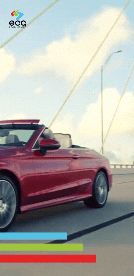 A red convertible drives across a bridge in a luxury car commercial, showcasing the seamless finishing & mastering that enhances high-end video productions.