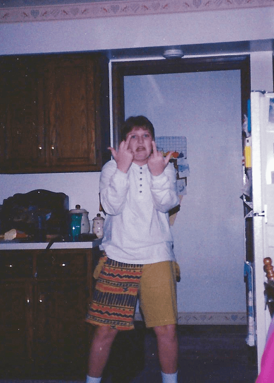 Jason Sirotin in navajo print flipping off the camera.