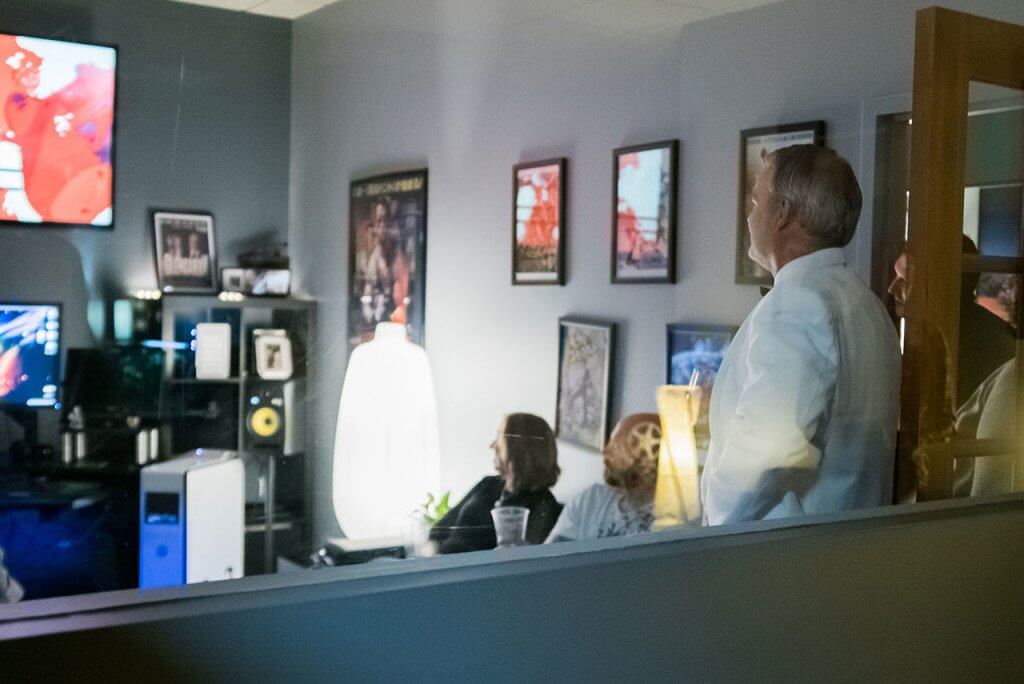 Stunning in his white tuxedo, show creator Jim Wilkie watches another run of the pilot behind a pleased crowd.