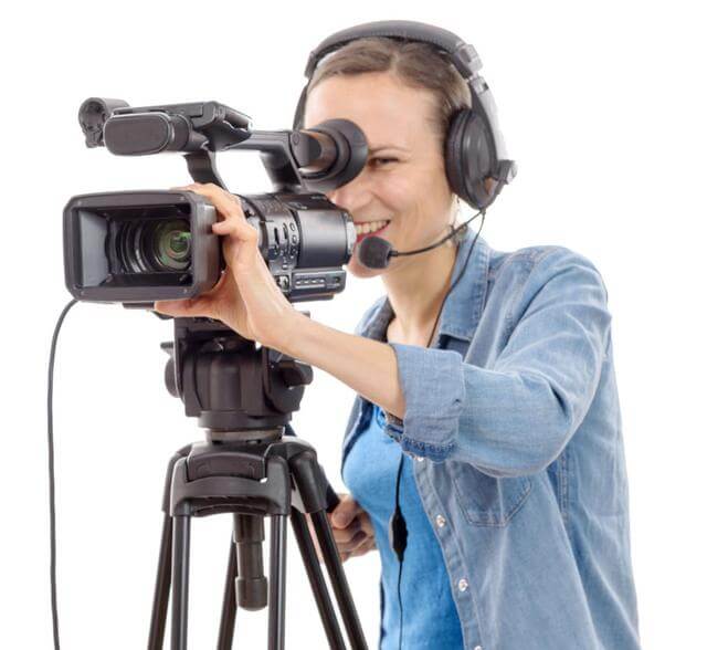 female video production professional behind the camera during a shoot