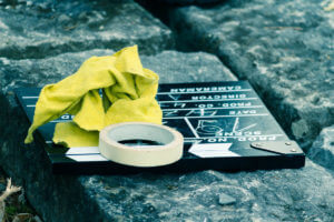 Big budget movie slate laying on ground with tape