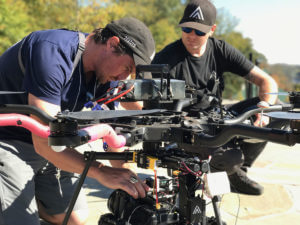 Two men from FAA-licensed Ascend Aerials work behind the scenes to prepare an octocopter to film a 2018 demo reel.