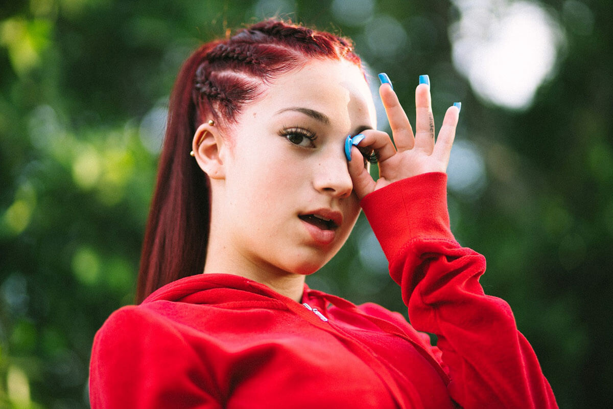 Danielle Bregoli's Bhad Bhabie wearing a red zip up sweat shirt.