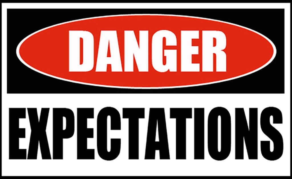 A danger sign warning you to manage expectations.