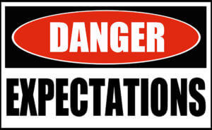 A danger sign warning you to manage expectations.