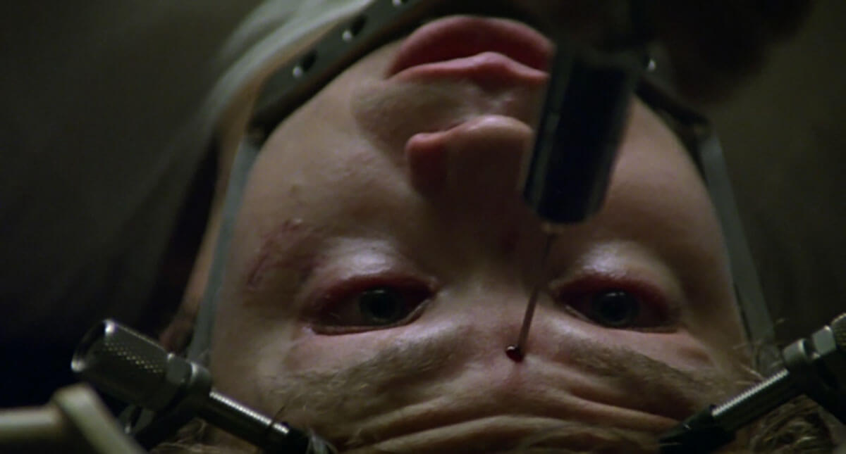 Jacob's Ladder horror movie where man is injected in forehead with needle.