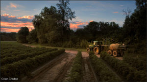 The image of a farm tractor after having been color graded.