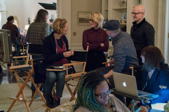 People talking behind the scenes on the set of House of Cards