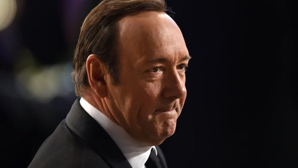 Kevin Spacey in a black suit and tie