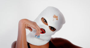 Woman in "Lil' Freak" music video wears a balaclava.