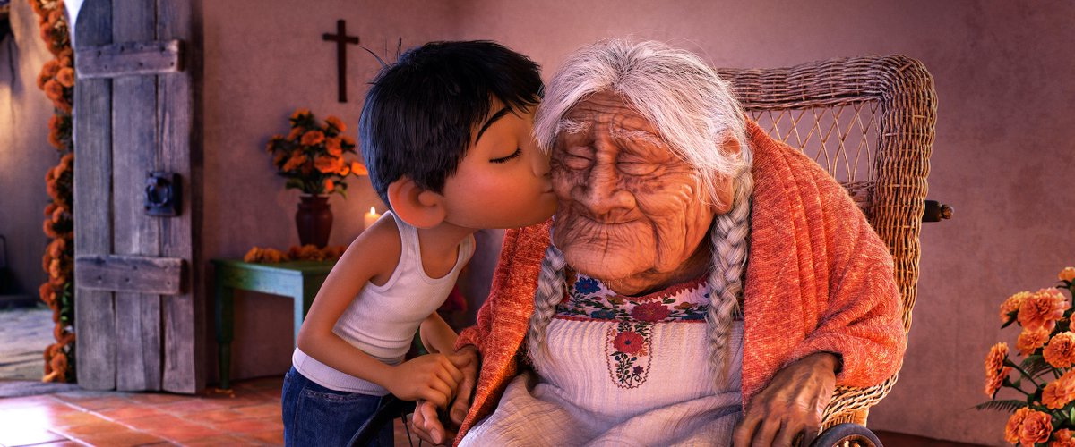 Miguel gives Mama Coco a kiss.