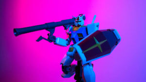 Gunpla with a pink and purple background.