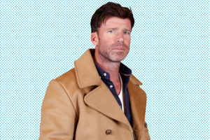 Taylor Sheridan in a brown jacket