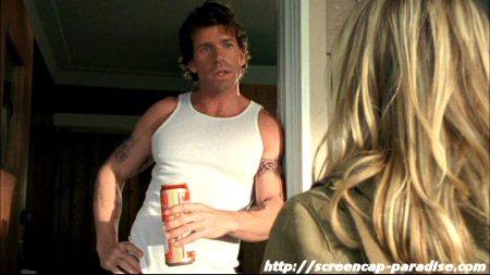 Taylor Sheridan leaning against a door frame on Veronica Mars.