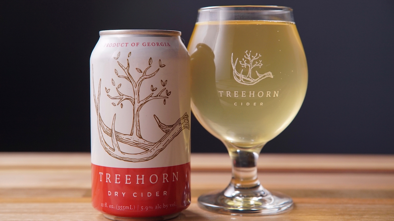 A TreeHorn Cider can and glass