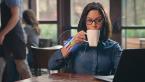 planar tracking video effect on woman holding coffee cup