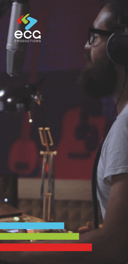 A Black man records a voiceover in a professional studio, demonstrating the impact of voiceover artists in delivering engaging and dynamic audio performances.