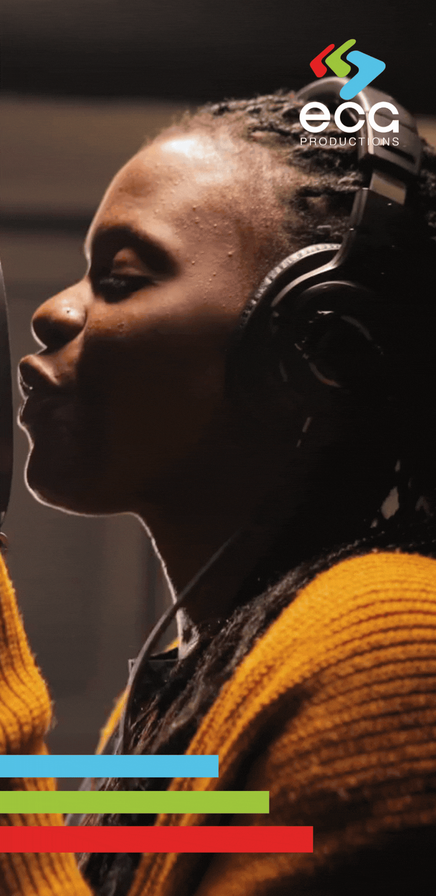 A Black woman passionately sings in a recording studio, bringing an original music composition to life with her powerful vocals.