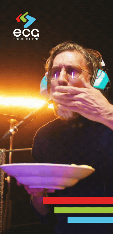 An older White man eats popcorn while recording an ADR scene, demonstrating the casual yet critical process of automated dialogue replacement in post-production. Group Looping ADR performance