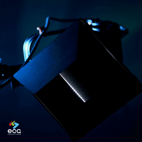An LED Fresnel light with barn doors opening, revealing a bright beam, showcasing the Lighting Department’s use of versatile, modern lighting tools for precise illumination control.