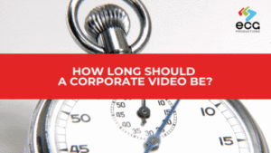 Close-up of a ticking stopwatch, overlaid with a red banner that reads “How Long Should a Corporate Video Be?”—emphasizing the importance of timing and audience attention span in corporate video production.