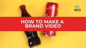 Classic Coca-Cola glass bottle and red can placed on a bold yellow background, with a red overlay reading “How to Make a Brand Video”—illustrating the power of iconic visuals in crafting standout brand video content