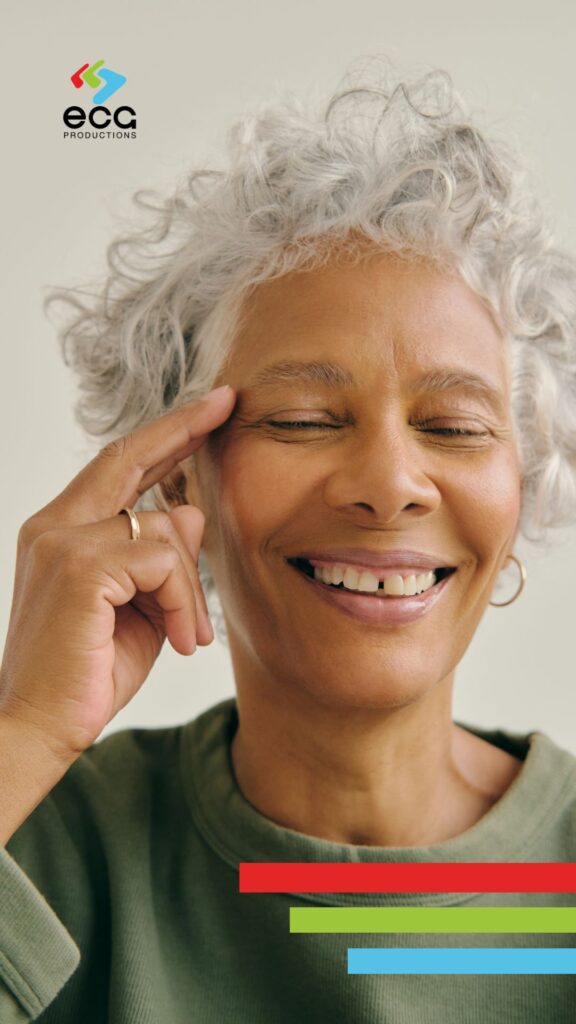 Elderly woman deep in thought with a slight smile and a noticeable gap in her teeth—symbolizing the importance of clarity and relatability when creating effective training videos.