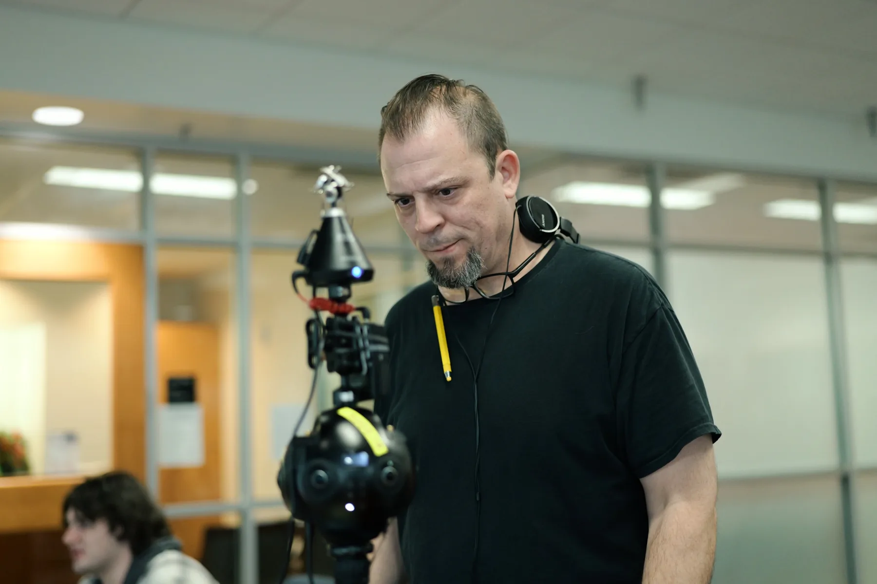 Director and performer reviewing a scene during an interactive VR learning production.