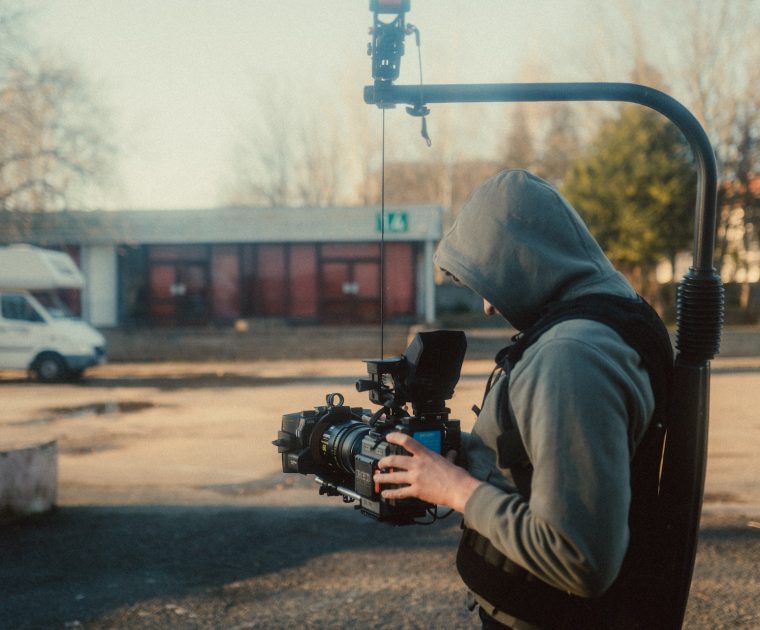 camera-operator-recording-using-rig camera operator using steadicam rig