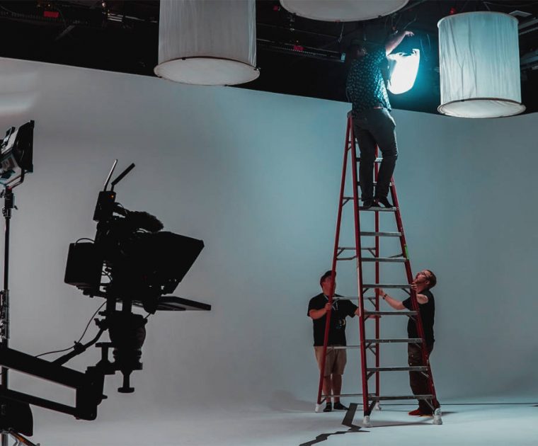 grip-and-gaff-hanging-lights-in-studio