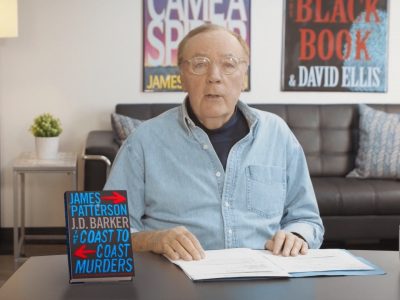 James Patterson at a table discussing his book Real Readers: The Coast to Coast Murders