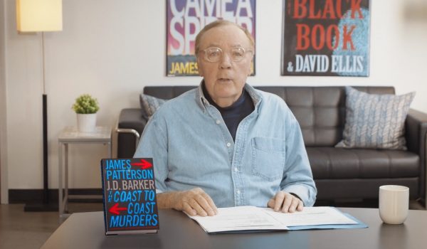 James Patterson at a table discussing his book Real Readers: The Coast to Coast Murders
