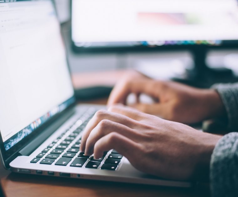 man-typing-on-laptop man types on laptop