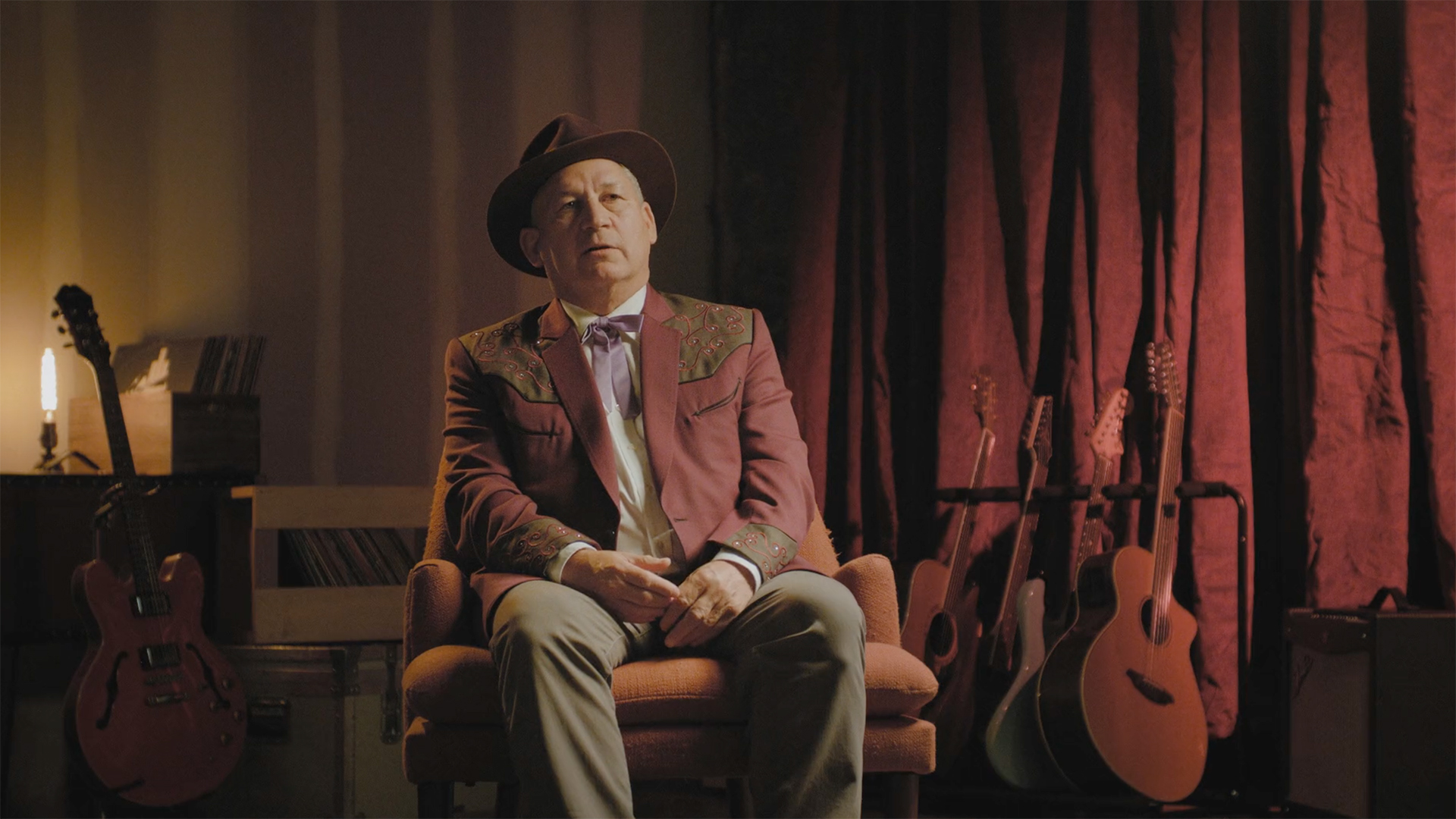 A man is interviewed for James Patterson's John Lennon biography, Last Days.