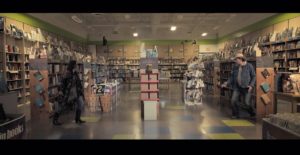 A man and woman in a bookstore have a standoff to get James Patterson's novel Texas Outlaw.