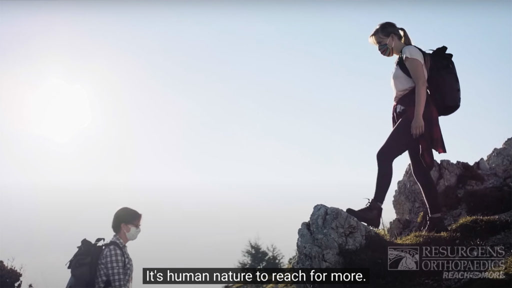 Two backpackers with masks illustrate the need for closed captions.