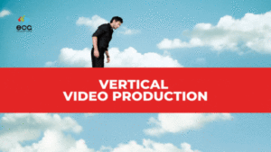 Man standing against a bright blue sky with fluffy clouds, framed in a tall, narrow view, overlaid with a bold red banner reading “Vertical Video Production”—highlighting the modern shift toward portrait-style storytelling for mobile-first audiences.